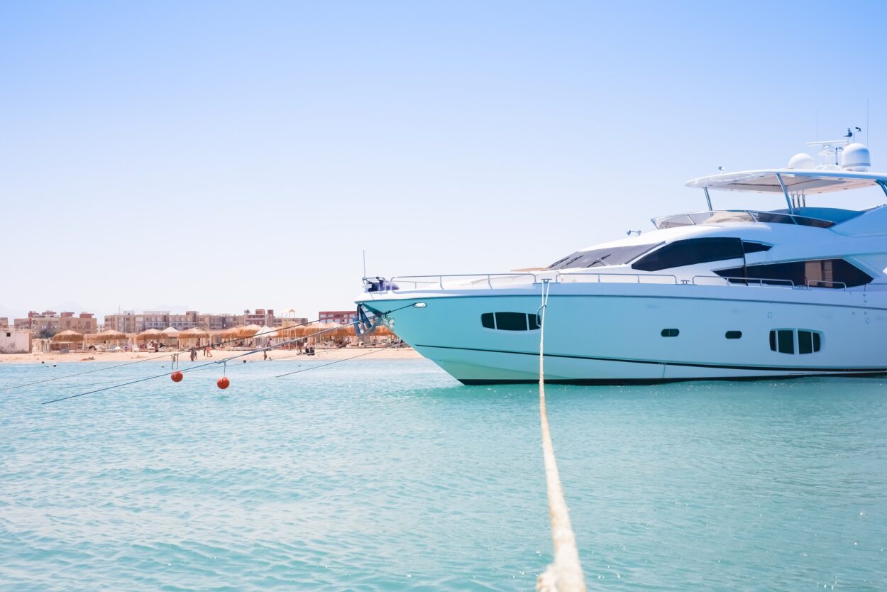 Luxury,Yacht,Anchored,Near,Sandy,Beach.